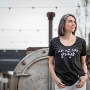 this organic girl wearing a black tshirt that says "amazing grays"