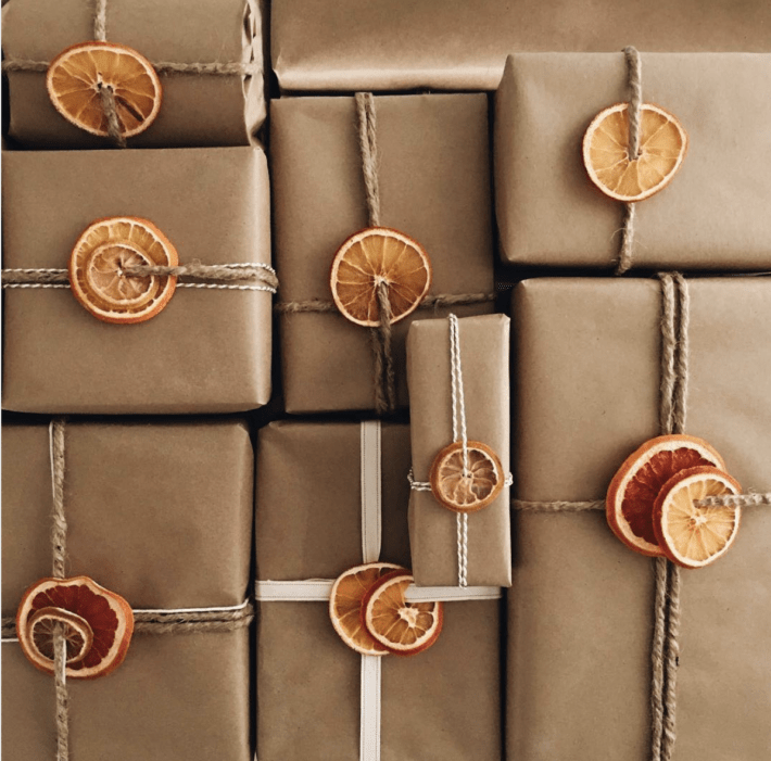 dreid oranges tied to brown paper packages tied with string