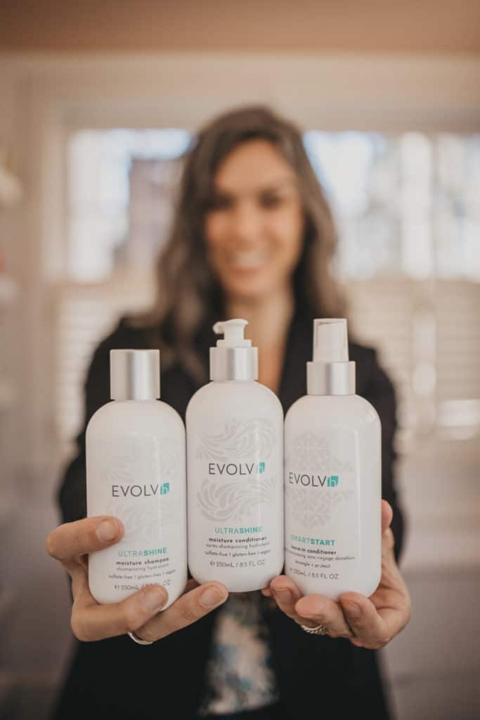 me holding three EVOLVh products in my hands