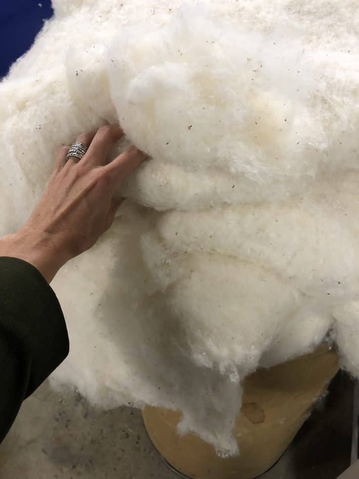touching a huge pile of wool with my hand