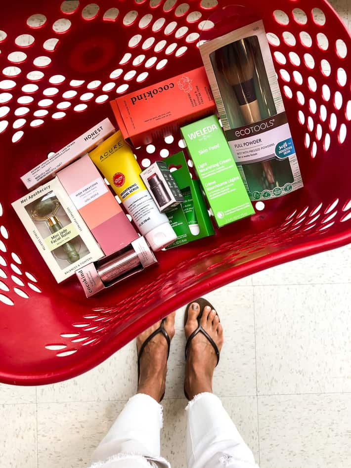 A red target hand basket full of beauty products