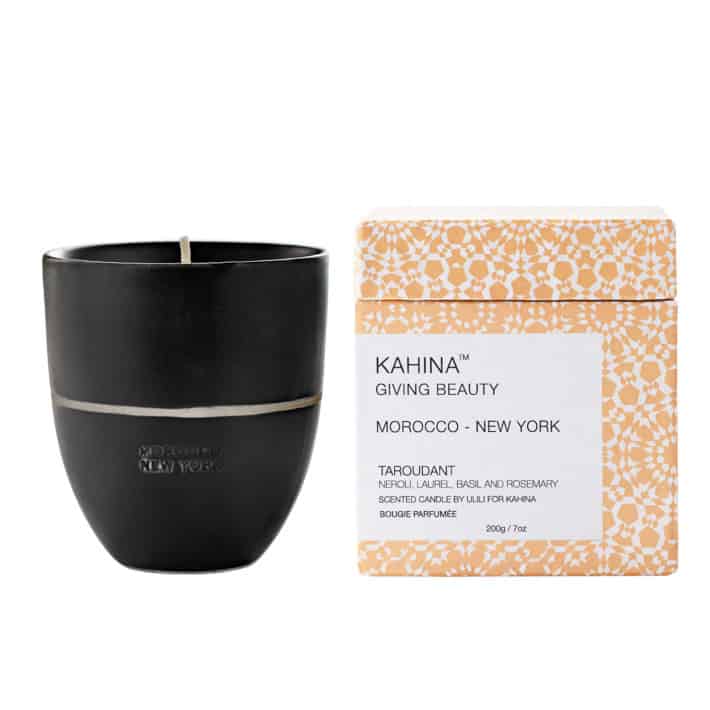 a nontoxic candle next to the box that it's packaged in