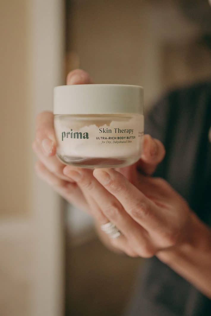 woman holding CBD cream from Prima