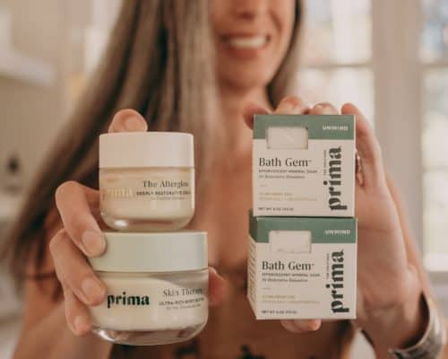 woman holding skincare products from Prima