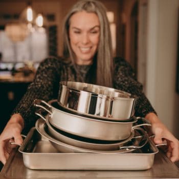 woman holding a pot with food from 360 cookware
