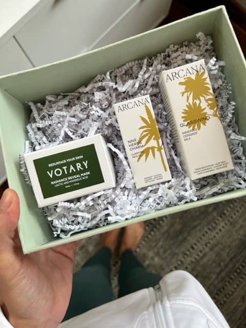 A green box filled with three green beauty products