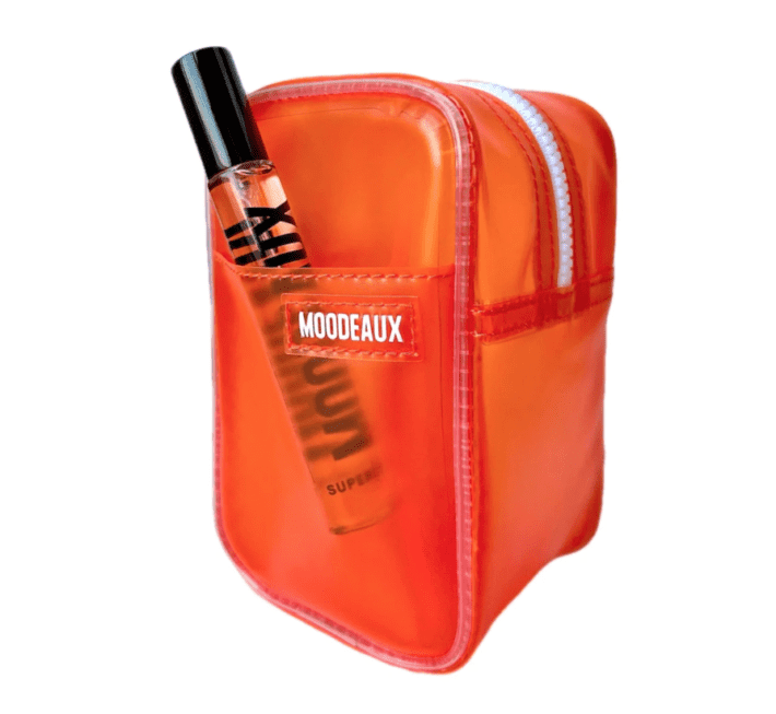 an orange bag with a fragrance called Worthy by Moodeaux