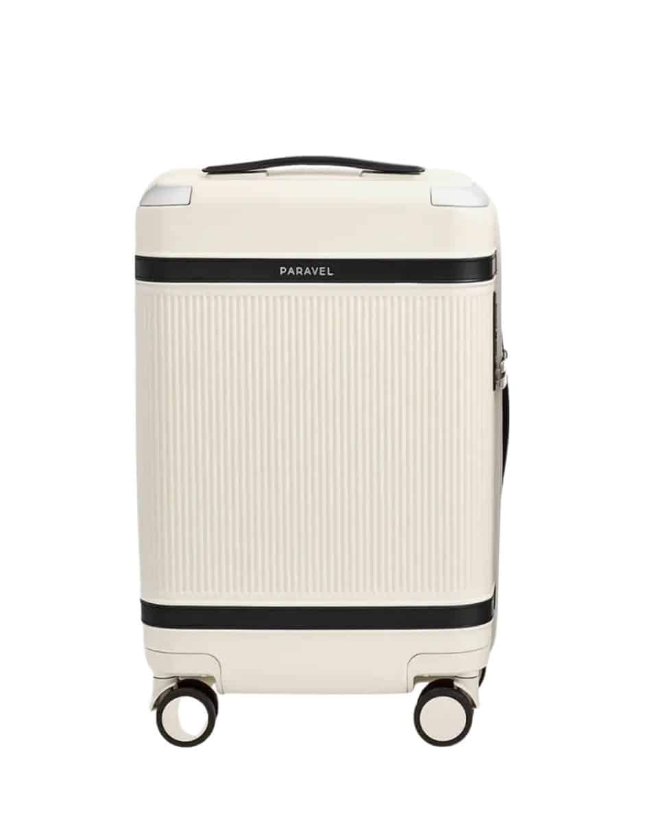 a carry on bag in cream and black