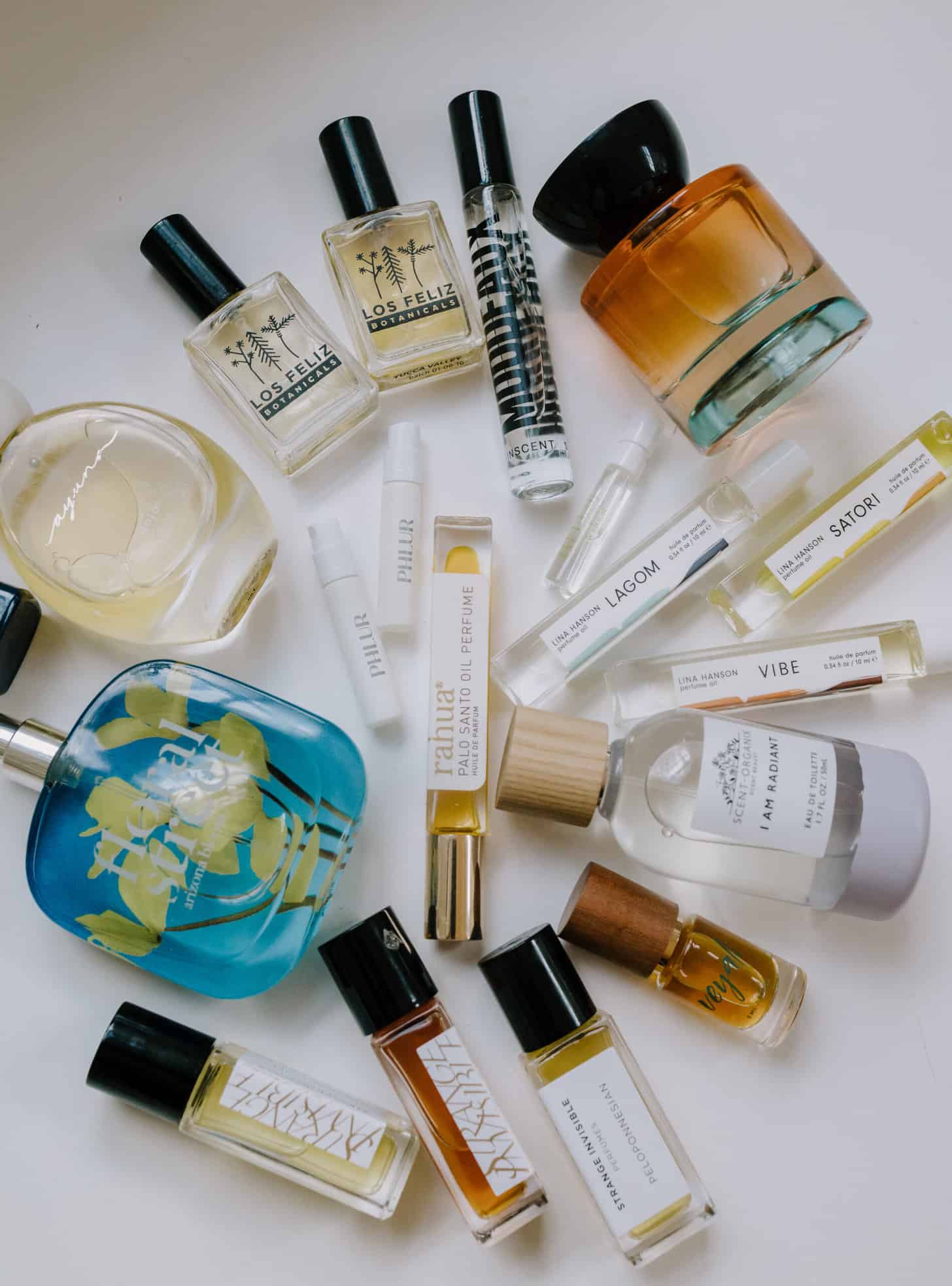 a flat lay collection of clean perfumes